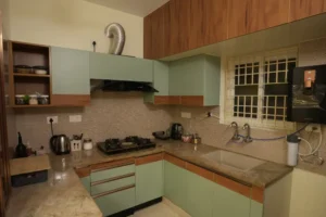 Teal green modular kitchen design