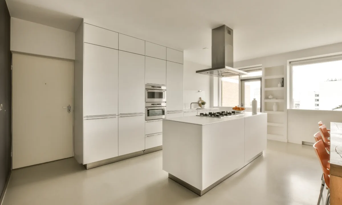 Large white island kitchen interior design